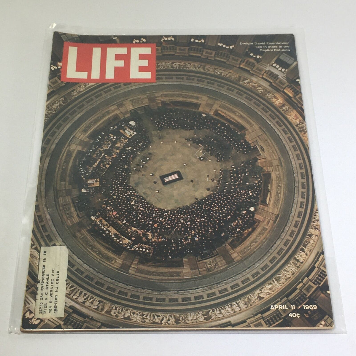 VTG Life Magazine: April 11 1969 featuring a historic image of Dwight David Eisenhower in the Capitol Rotunda, showcasing a large crowd gathered to pay tribute, with the magazine title prominently displayed.