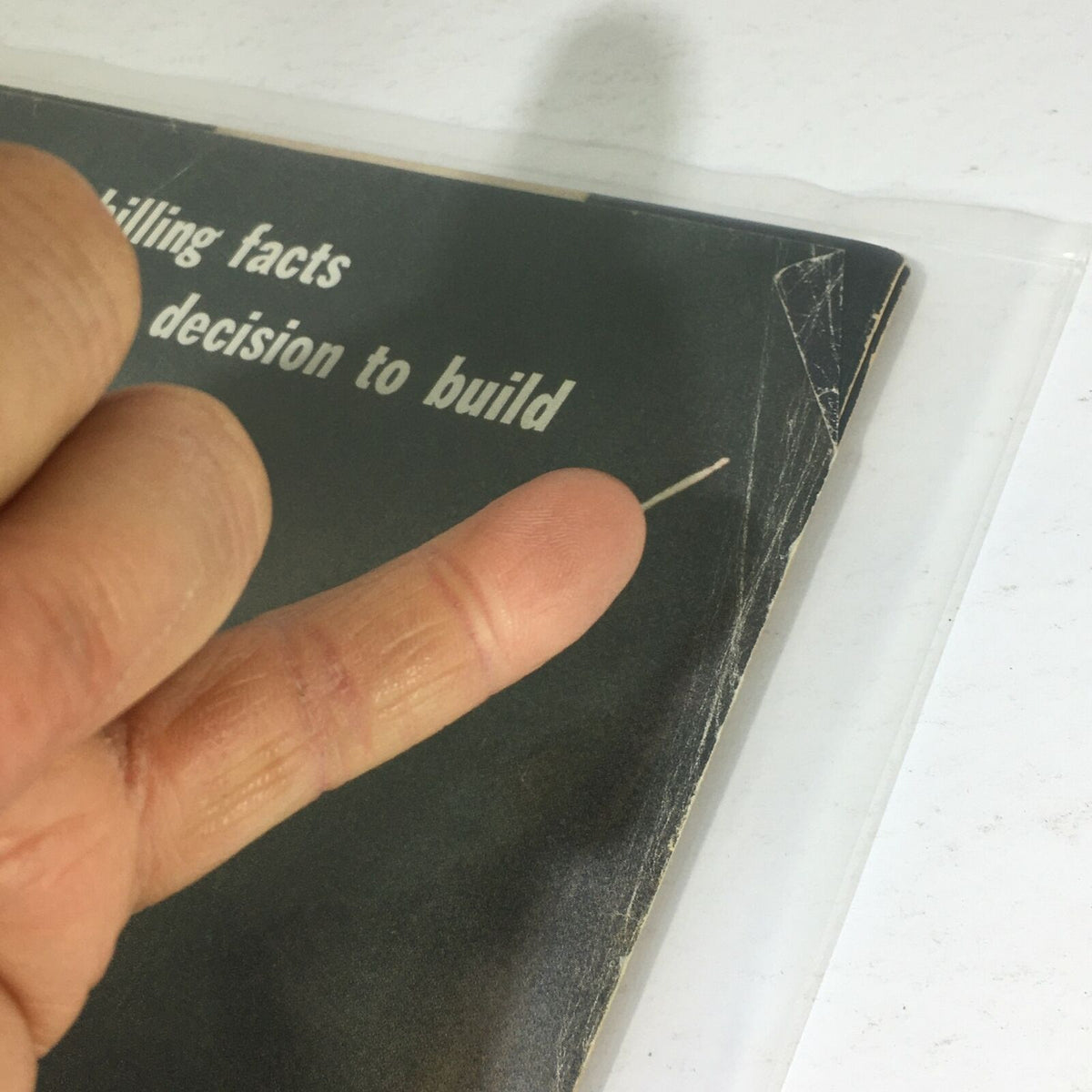 Close-up detail of the cover from VTG Life Magazine: September 29 1967, showing wear and a finger pointing at the text, emphasizing the chilling facts behind the decision to build the Anti Ballistic Missile.