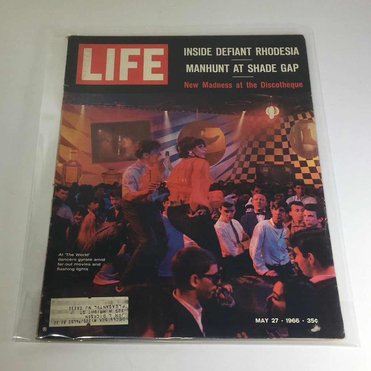 Vintage Life Magazine Cover from May 27, 1966 featuring 'New Madness at the Discotheque' and 'Manhunt at Shade Gap' with vibrant nightlife imagery and cultural reflections of the 1960s.
