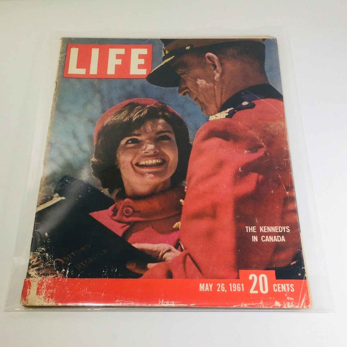 Cover of VTG Life Magazine dated May 26, 1961 featuring The Kennedy's in Canada, highlighting Jackie Kennedy in a red coat and hat, smiling while interacting with a soldier.