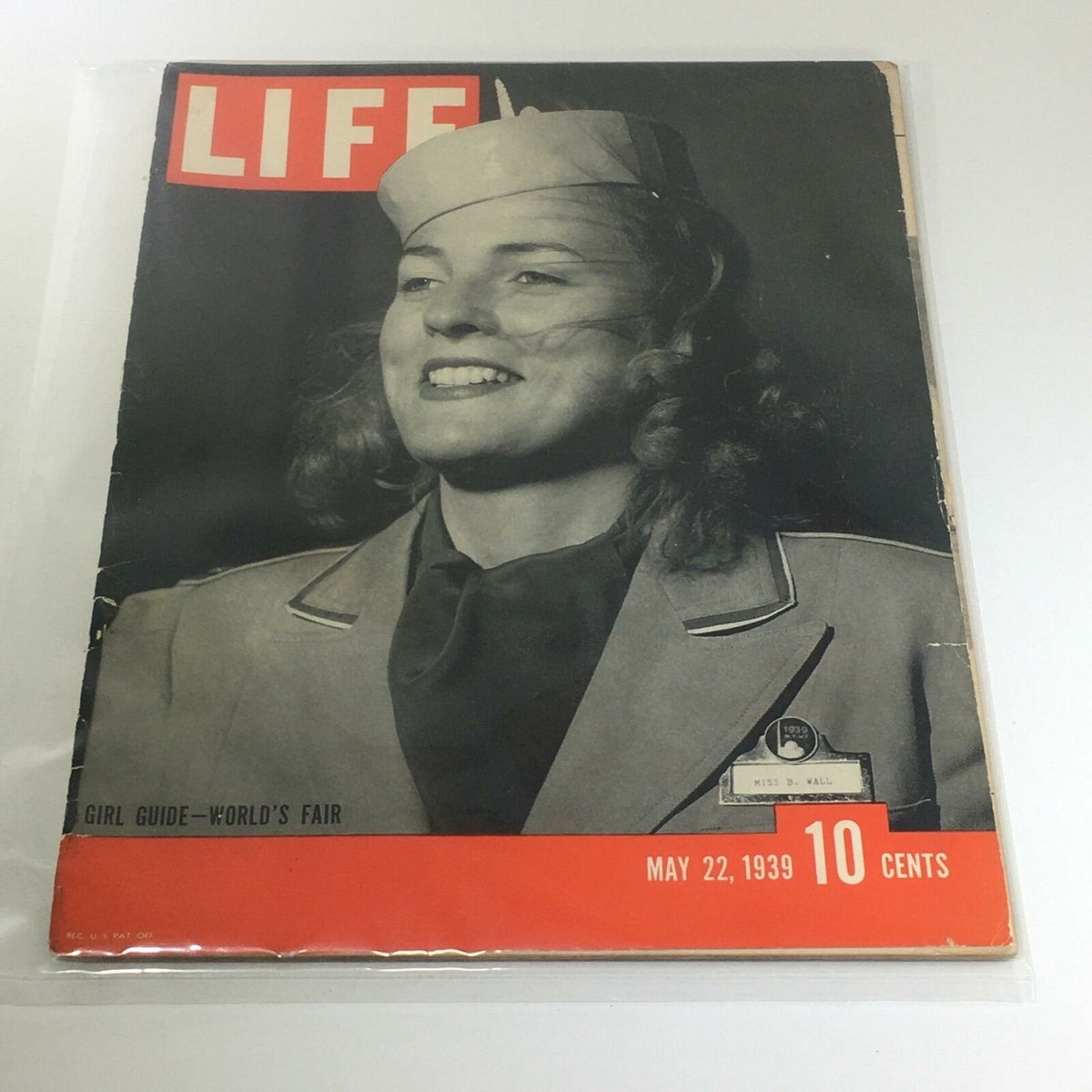 Cover of Vintage Life Magazine from May 22, 1939, featuring a smiling Girl Guide in uniform, associated with the World's Fair, showcasing historical significance and vintage appeal.