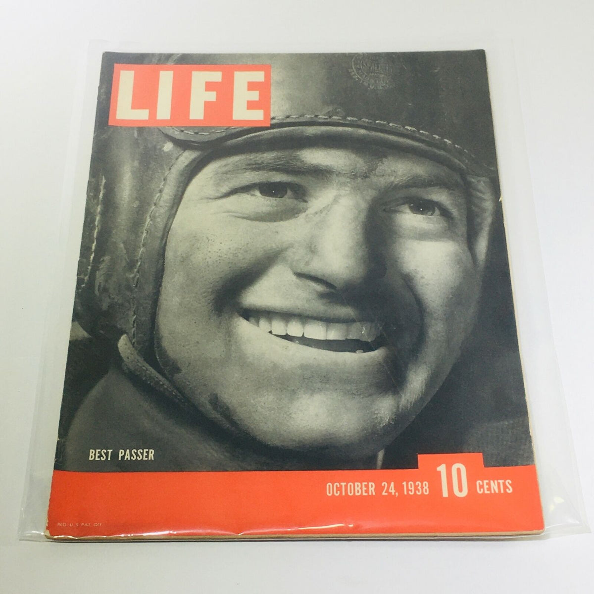 Vintage Life Magazine cover dated October 24, 1938, featuring the title 'Best Passer.' The magazine showcases a smiling male figure in vintage football attire, highlighting its collectible nature.