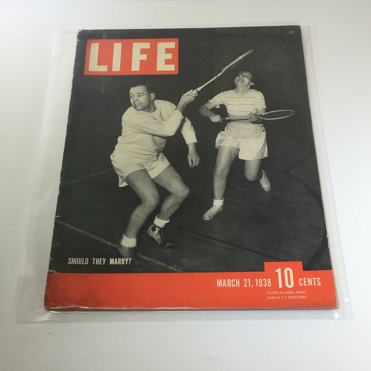 Vintage Life Magazine Cover from March 21, 1938 titled 'Should They Marry?'. The cover features two individuals playing tennis, showcasing the vintage style and cultural significance of the magazine.