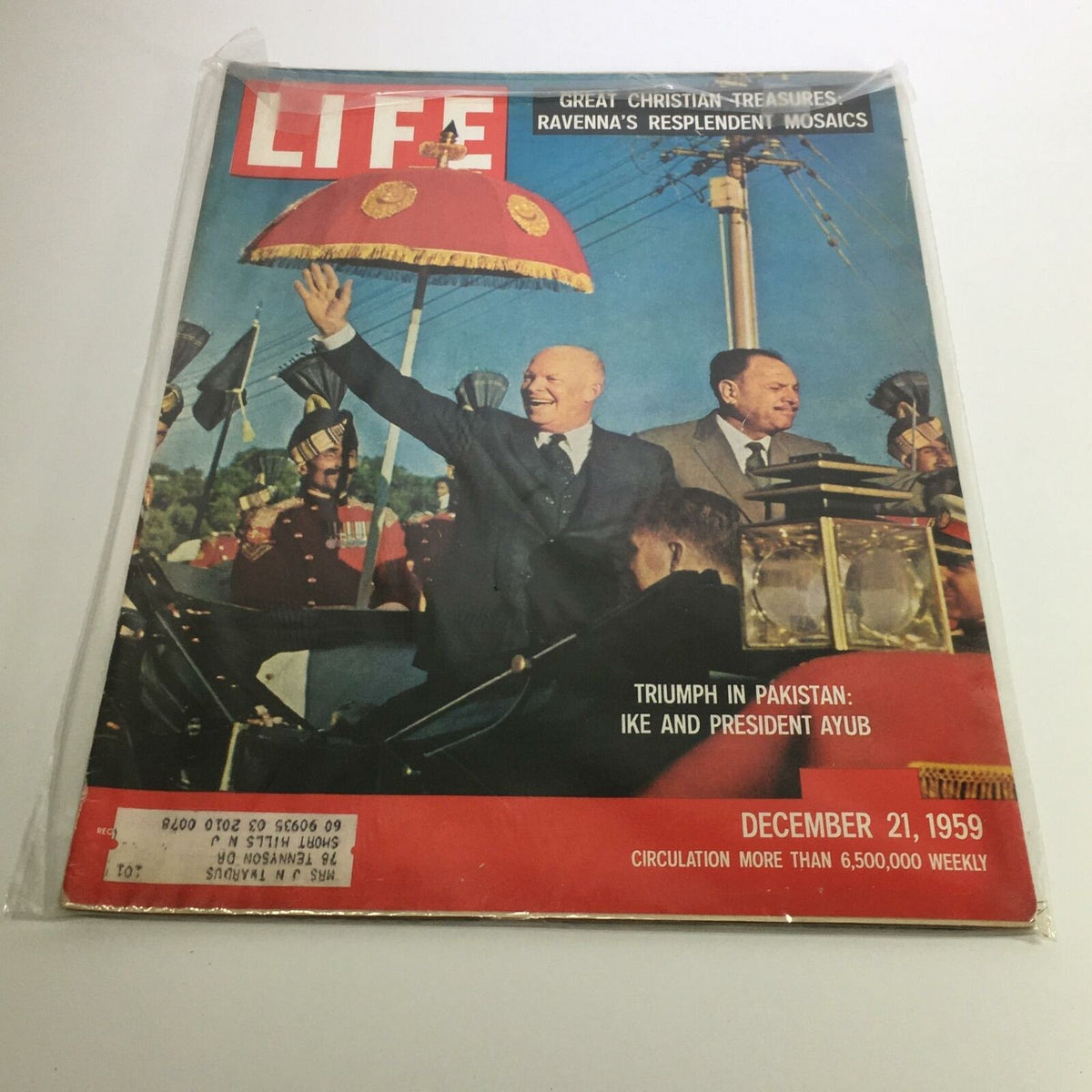 Life Magazine cover from December 21, 1959, featuring Dwight D. Eisenhower waving during his visit to Pakistan with President Ayub. The cover highlights historical significance in U.S.-Pakistan relations and depicts a vibrant moment in the Cold War era.