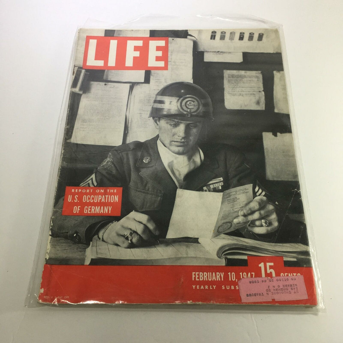 Cover of Life Magazine February 10, 1947, featuring a soldier reviewing documents related to the U.S. Occupation of Germany.