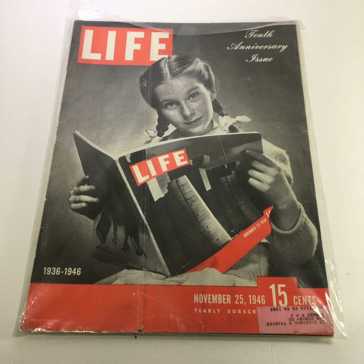 Life Magazine Tenth Anniversary Issue Cover from November 25, 1946, featuring a girl reading the magazine, showcasing vintage design and historical significance.