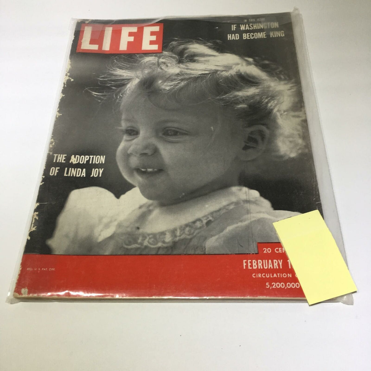 Cover of VTG Life Magazine from February 19, 1951, featuring 'The Adoption of Linda Joy,' showcasing a smiling child with curly hair against a distinct red background, a captivating piece of history for collectors.