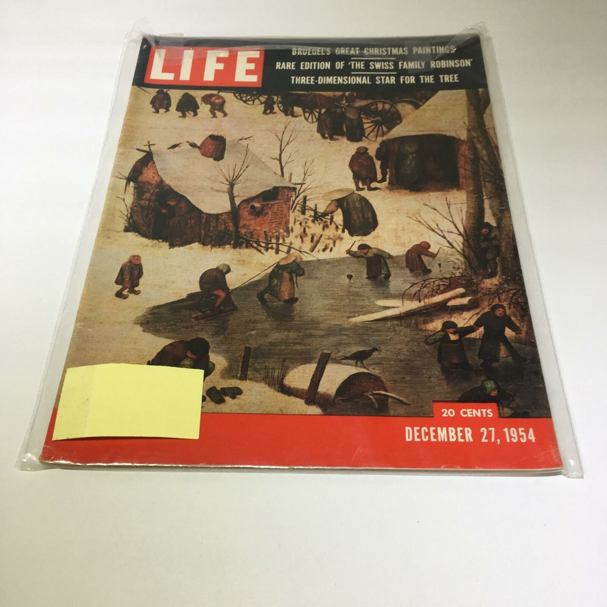 Vintage Life Magazine cover from December 27, 1954, featuring Bruegel's artwork and highlighting 'The Swiss Family Robinson'. The cover displays a charming winter scene with people engaging in seasonal activities, emblematic of mid-20th century culture.