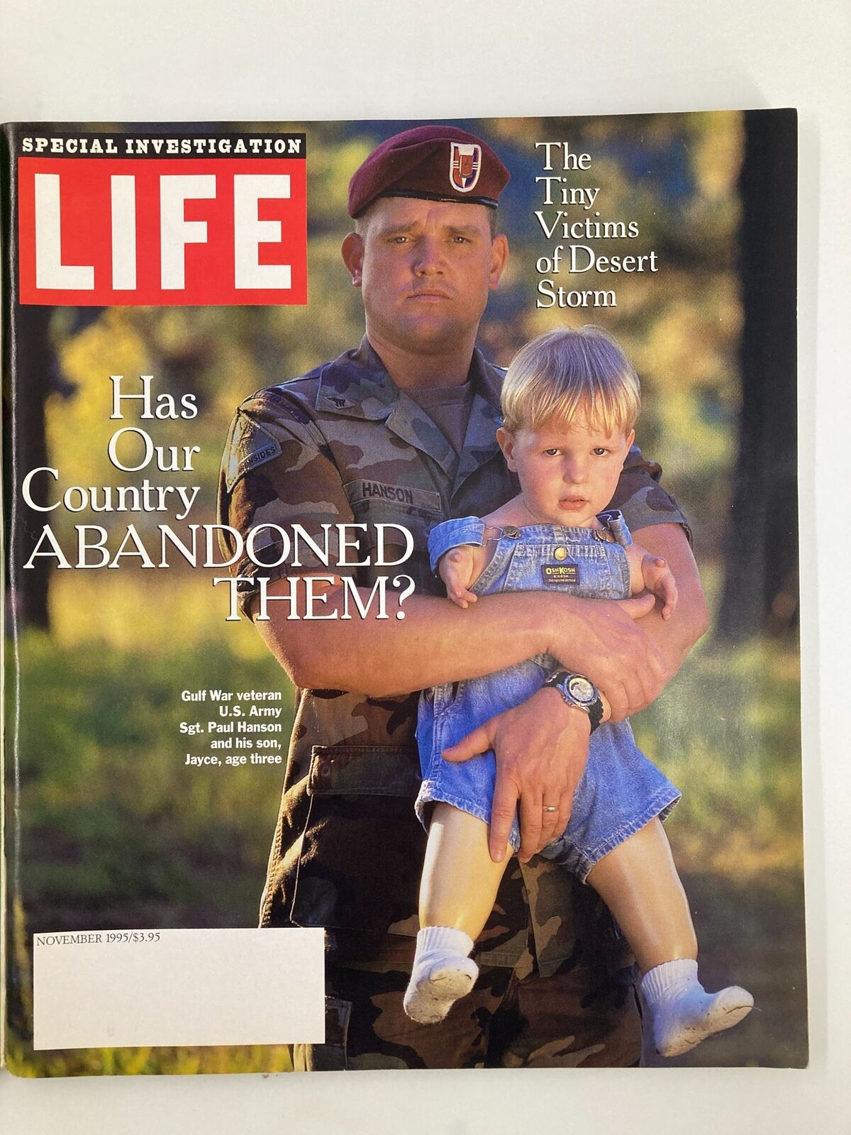 Life Magazine November 1995 cover featuring U.S. Army Sgt. Paul Hanson holding his son Jayce, with the headline questioning if the country has abandoned military families, capturing the emotional bond of service families.