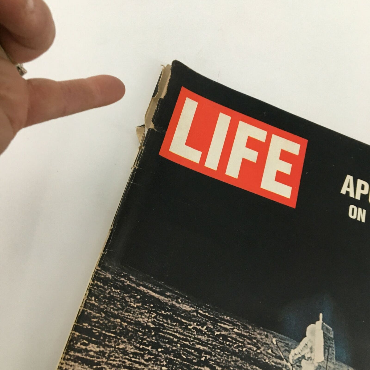 Close-up view of the VTG Life Magazine December 12 1969, highlighting the worn edge of the cover featuring Apollo 12 on the Moon.