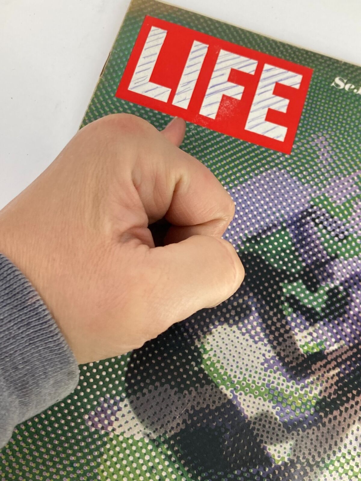 Vintage Life Magazine cover from April 4, 1969, featuring the title and a hand gripping the magazine, showcasing its unique design and era charm. Ideal for collectors and history enthusiasts.