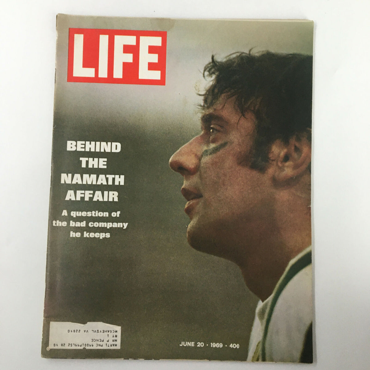 VTG Life Magazine June 20 1969 cover featuring the title 'Behind The Namath Affair'. The cover depicts a close-up profile of Joe Namath, showcasing the intrigue surrounding his life and career. An iconic piece of sports memorabilia, this issue explores Joe Namath's influence on American culture during the late 1960s.
