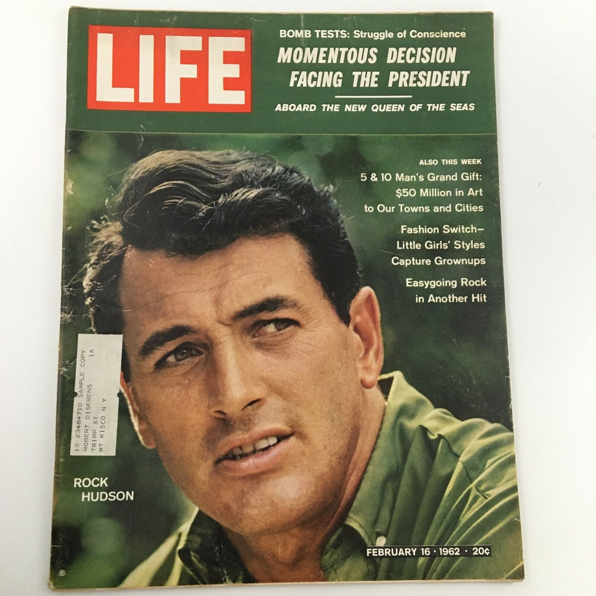 Image of the VTG Life Magazine dated February 16, 1962, featuring Rock Hudson on the cover. The magazine highlights articles including 'Bomb Tests: Struggle of Conscience' and features vintage advertisements, showcasing cultural insights from the 1960s.