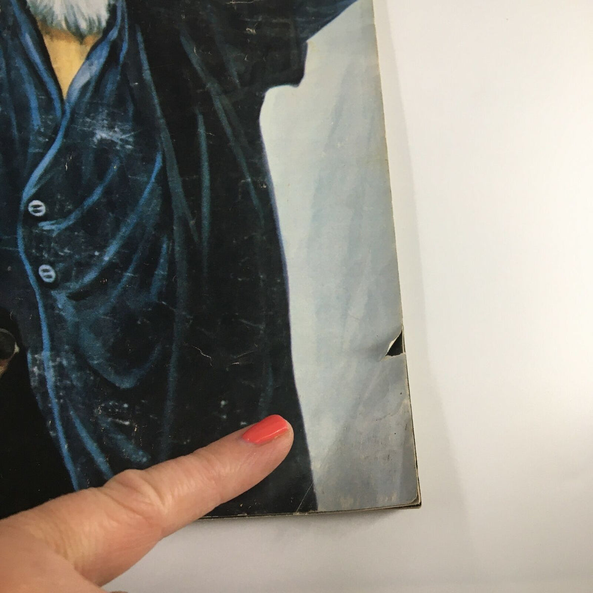 Detailed view of VTG Life Magazine January 1980 cover highlighting imperfections, including a crease, pointing towards Khomeini's fierce outcry against America, adding to its vintage appeal.