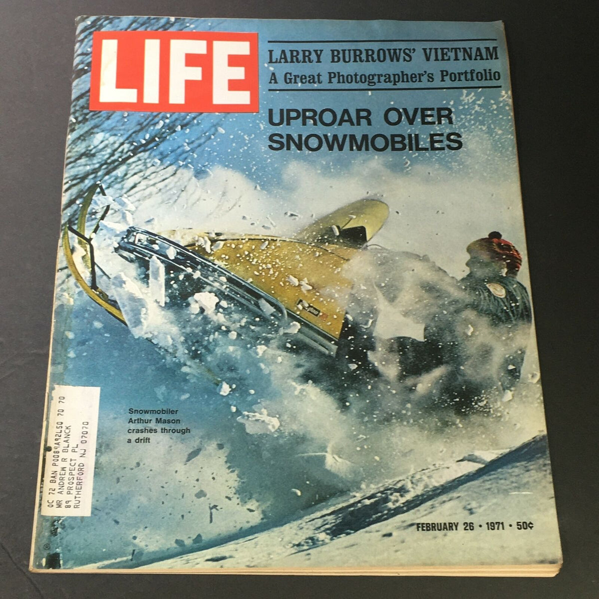 Cover of Vintage Life Magazine from February 26, 1971, featuring the title 'Larry Burrow's Vietnam' and a snowmobiler crashing through the snow, along with commentary by Arthur Mason.