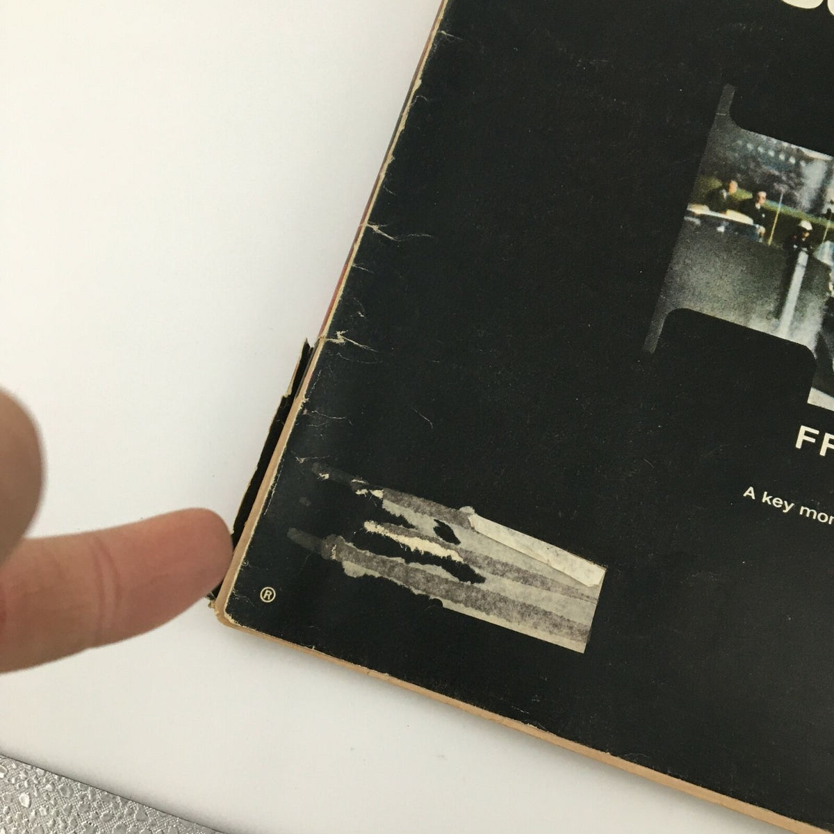 Side view of the VTG Life Magazine from November 25, 1966, showing minor wear on the edges, emphasizing its vintage character and connection to historical events.