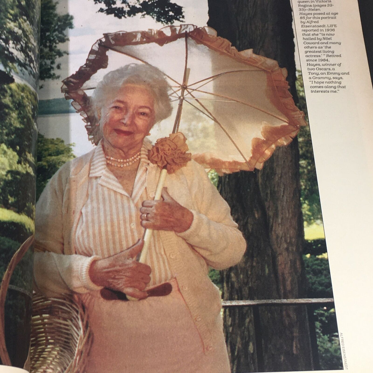 Feature image from Life Magazine September 1986, depicting a charming elderly woman holding an ornate parasol, representing style and grace in a bygone era.