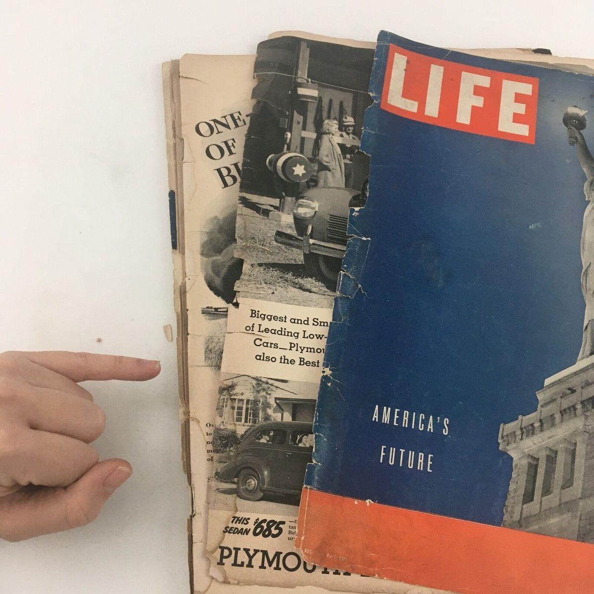 VTG Life Magazine June 5 1939 with visible wear and historical imagery depicting America's future, showcasing the magazine's vintage charm and condition with a person's hand pointing at it.
