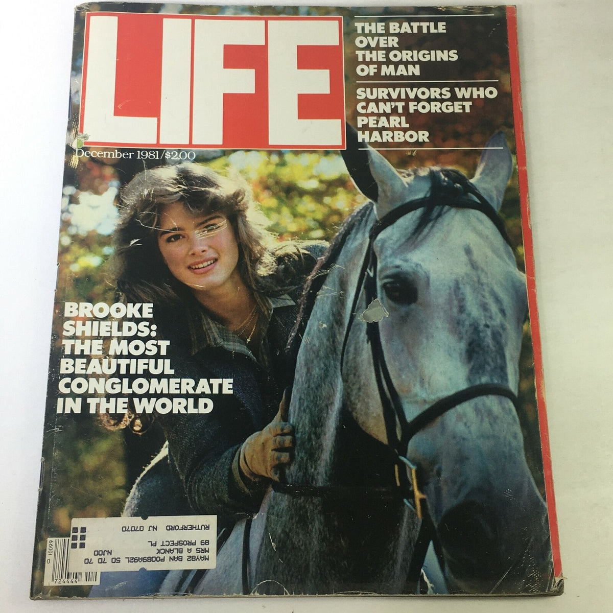 Cover of VTG Life Magazine December 1981 featuring Brooke Shields, showcasing headlines on the origin of man and Pearl Harbor, highlighting the magazine's vintage aesthetic.