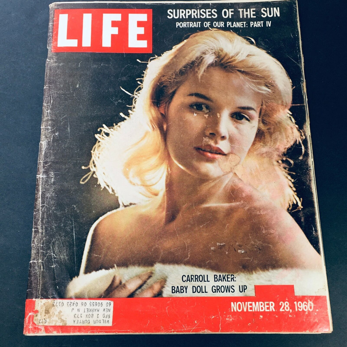 Vintage Life Magazine cover from November 28, 1960 featuring actress Carroll Baker with the headline 'Baby Doll Grows Up', showcasing her prominence in the entertainment industry during the 1960s.
