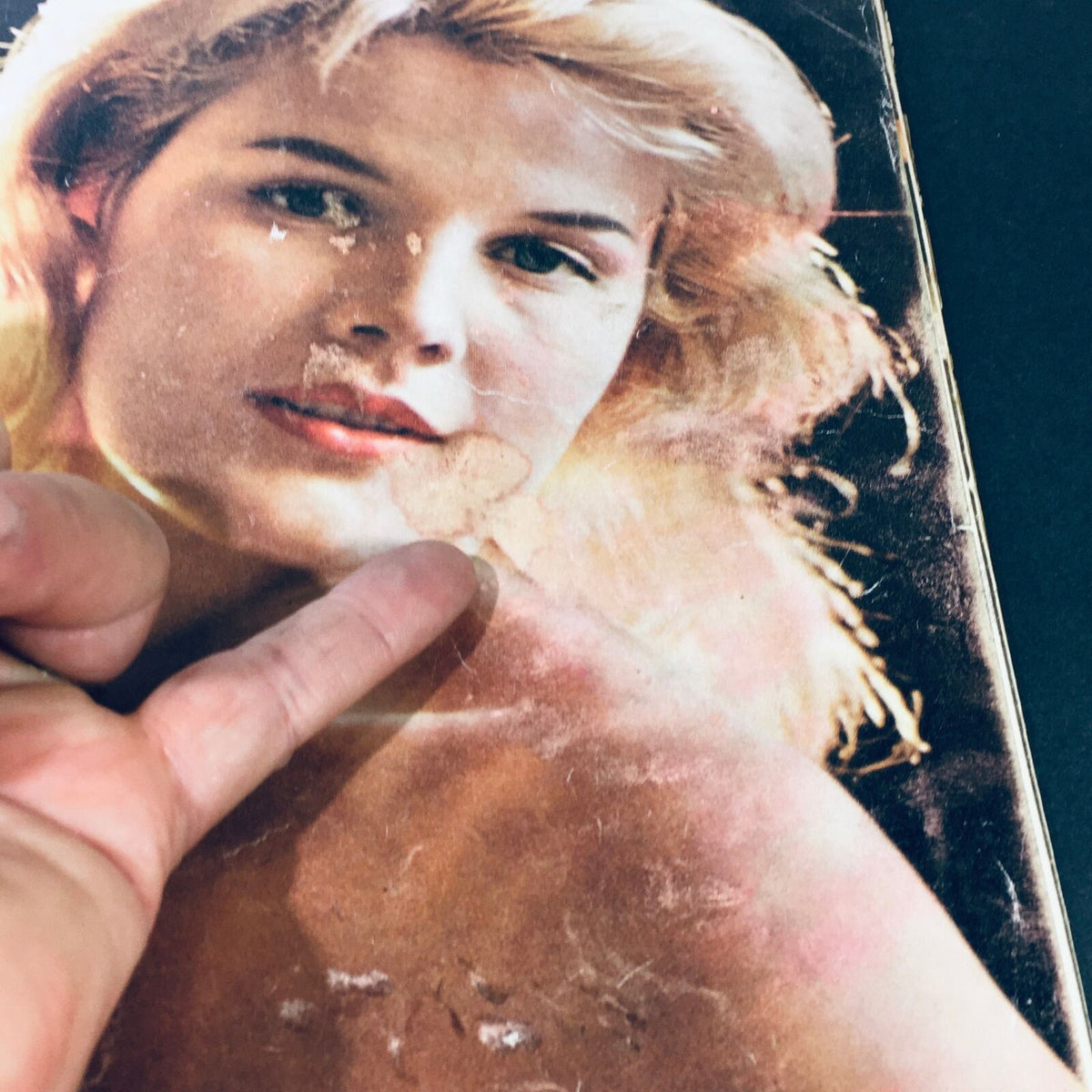 Close-up of the cover of 'VTG Life Magazine November 28 1960 - Carroll Baker Baby Doll Grows Up', focusing on imperfections and the magazine's nostalgic appeal.