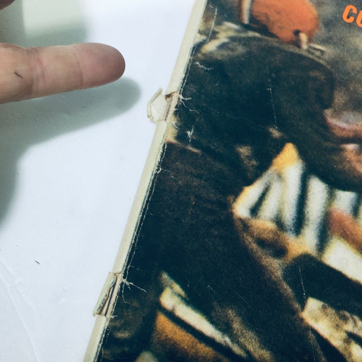Close-up of the spine of VTG Life Magazine October 14, 1966 highlighting wear and an address label on the cover, illustrating its vintage character.
