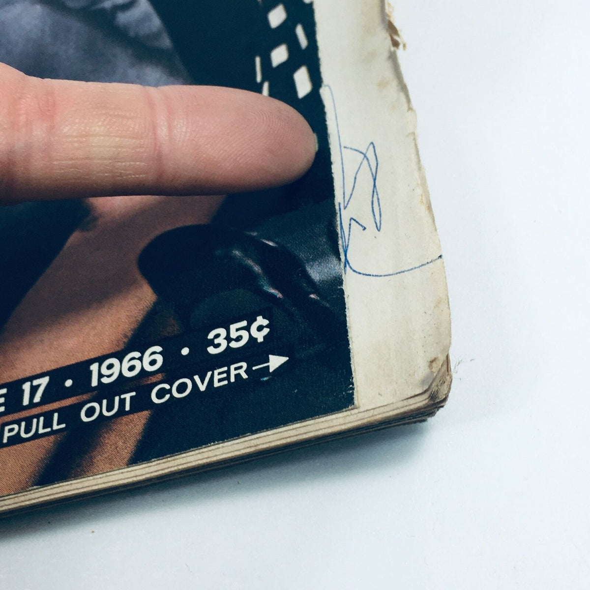 Close-up of the edge of the VTG Life Magazine July 17, 1966 highlighting visible wear and a small signature on the cover.