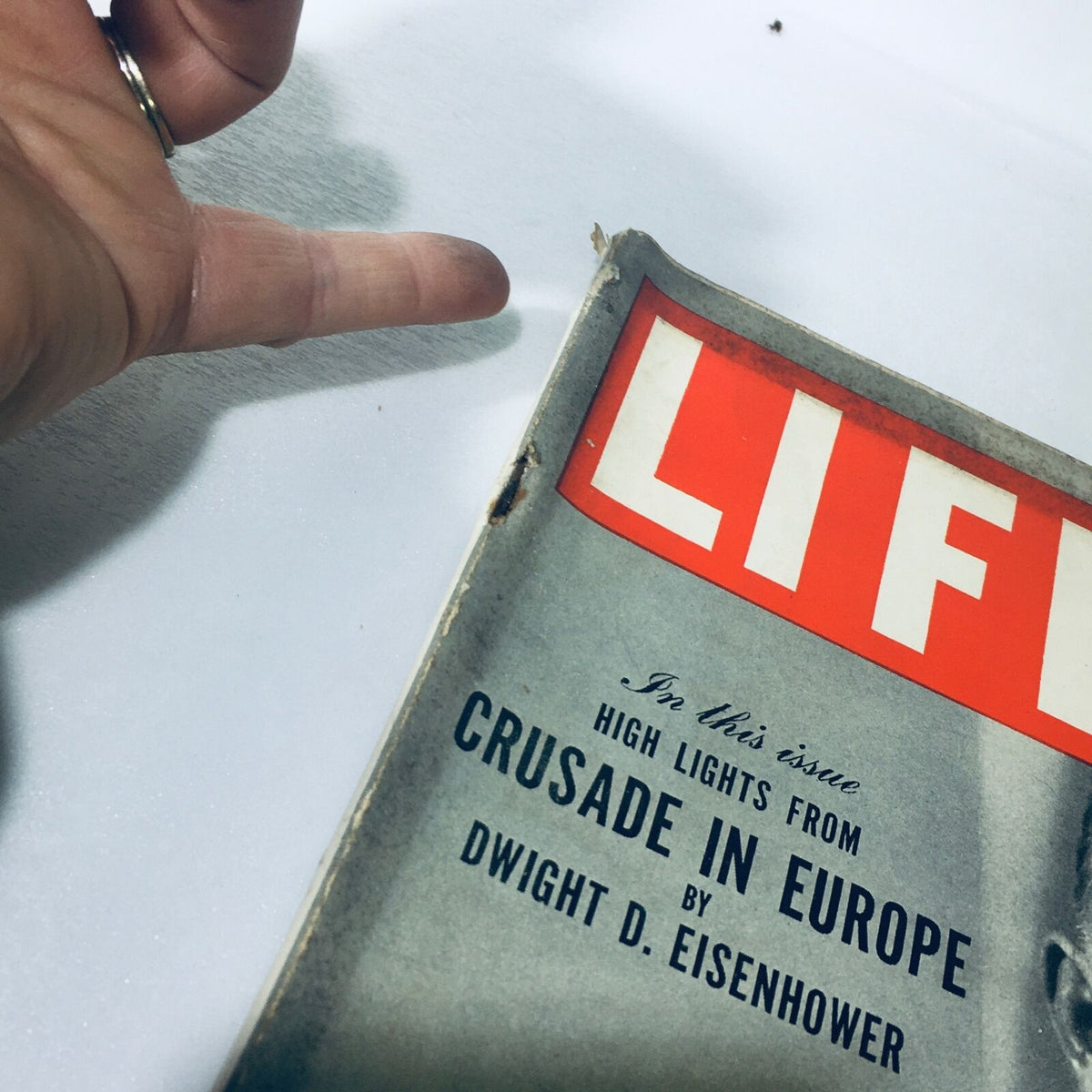 Close-up view of the edge of VTG Life Magazine December 13 1948, showing minor wear and the title 'Crusade in Europe' by Dwight D. Eisenhower.