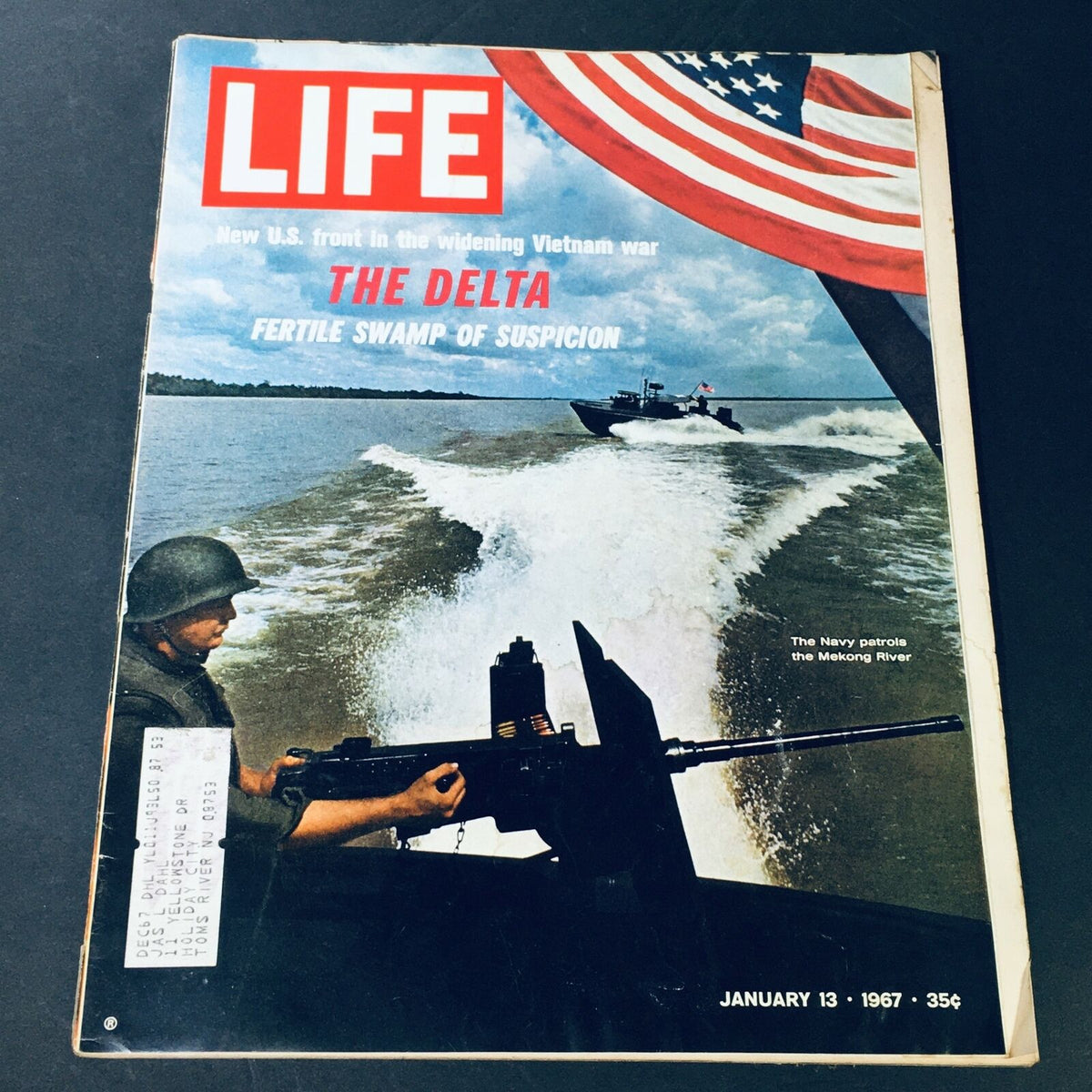 Cover image of VTG Life Magazine dated January 13, 1967, featuring the title 'The Delta Fertile Swamp of Suspicion.' The cover depicts a soldier on a boat patrolling the Mekong River, set against a backdrop of an American flag.