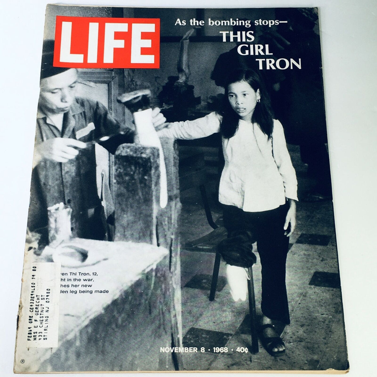Vintage Life Magazine cover from November 8, 1968, titled 'As The Bombing Stops - This Girl Tron'. The cover features a black and white photograph of a girl, Thi Tron, standing beside a man working on a prosthetic leg in a post-war context.