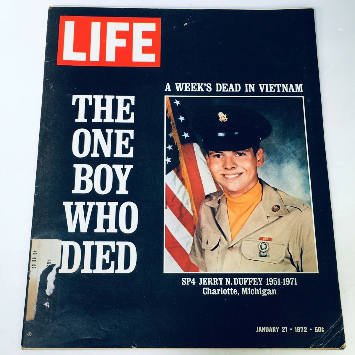 Vintage Life Magazine cover from January 21, 1972, featuring SP4 Jerry N. Duffey, with the headline 'The One Boy Who Died' and a backdrop of the American flag.