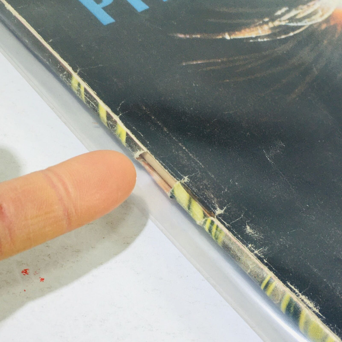 Another close-up of the edge of the VTG Life Magazine: December 23, 1966, highlighting its used condition with visible damage.