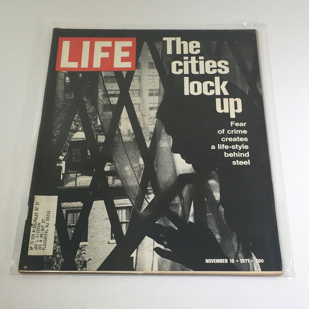 Cover of VTG Life Magazine dated November 19, 1971, featuring the headline 'The Cities Lock Up' addressing the fear of crime and its impact on urban life, with a silhouetted figure and a backdrop of metal bars.