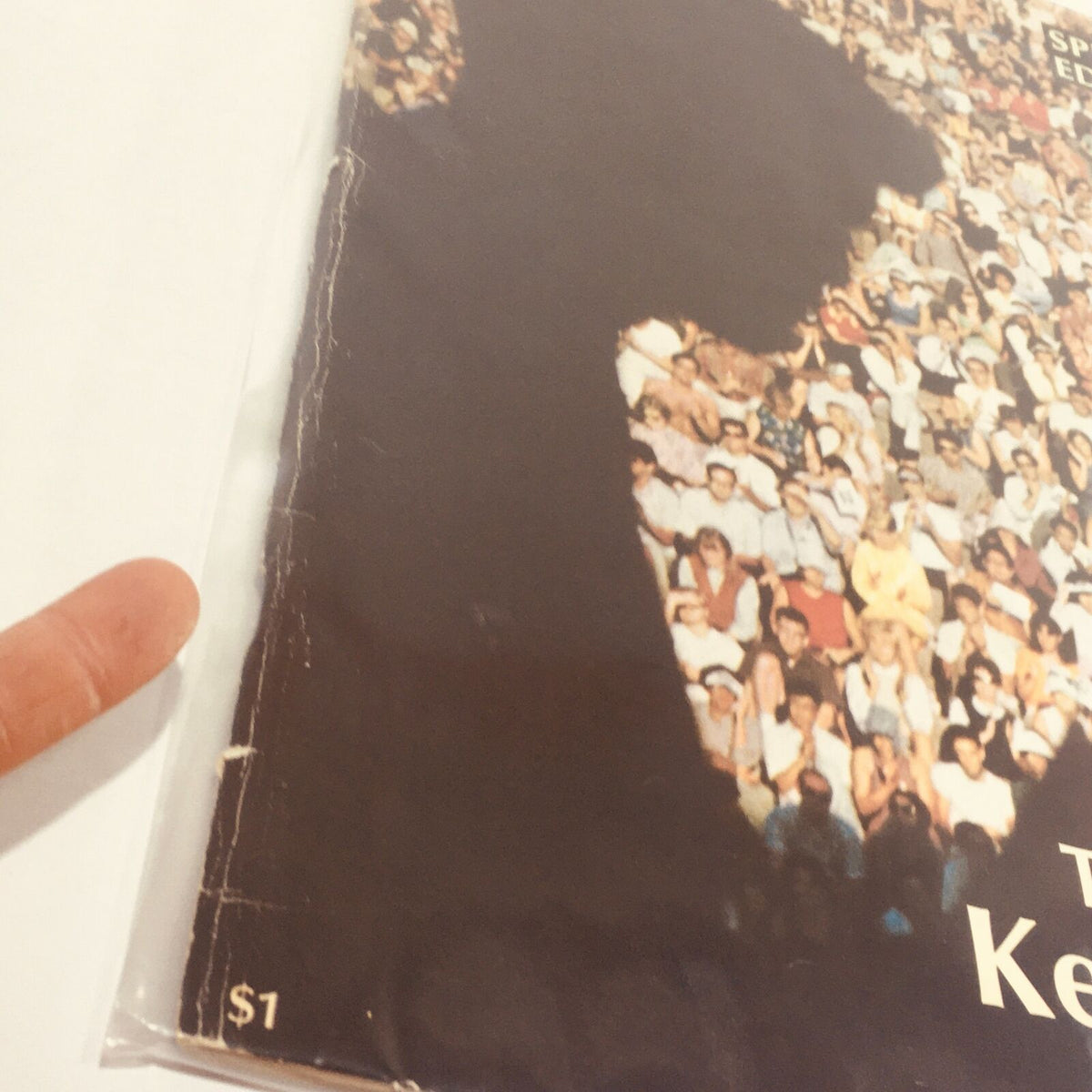 Cover detail of VTG Life Magazine: 1968 - Special Edition: The Kennedys, showcasing a crowd image and indicating the magazine's price of $1. This vintage publication is a rare collectible reflecting the Kennedy family's influence in American history.