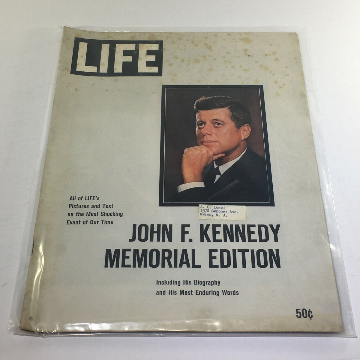 1963 Life Magazine: John F. Kennedy Memorial Edition cover showcasing a portrait of JFK with text highlighting its memorial significance and including his biography.