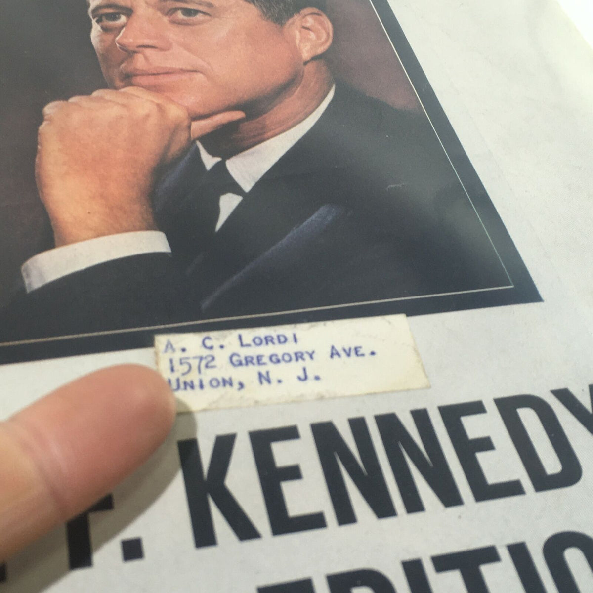 Close-up of the 1963 Life Magazine: John F. Kennedy Memorial Edition cover featuring a handwritten address label alongside JFK's portrait.