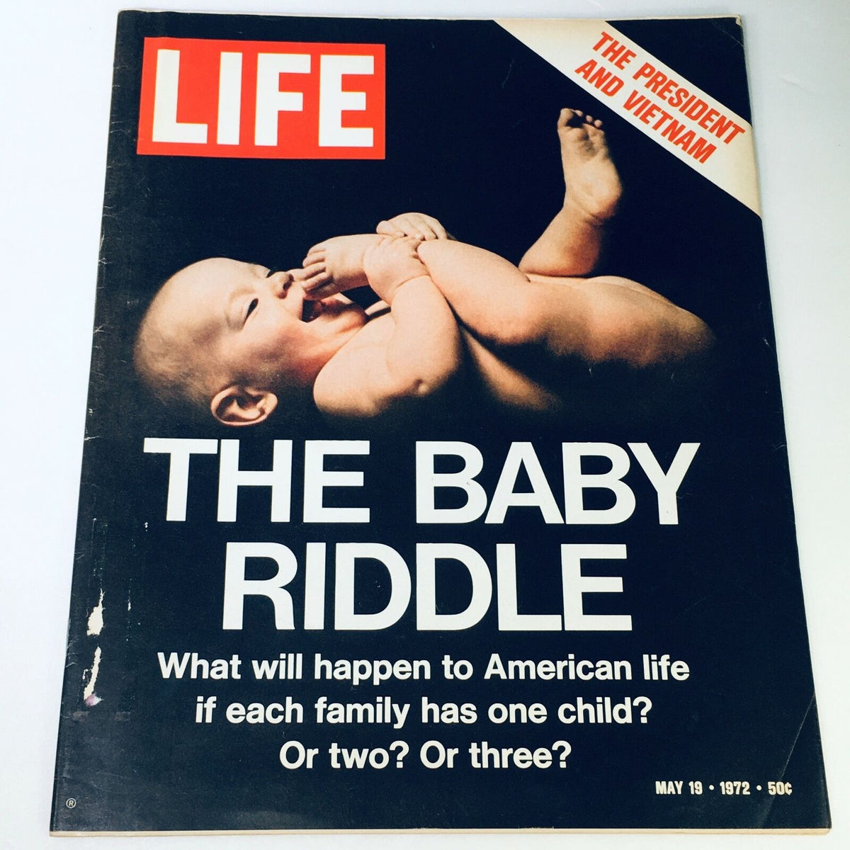 Cover of VTG Life Magazine from May 19, 1972, featuring the article 'The Baby Riddle' alongside a piece titled 'The President and Vietnam'. The cover features an image of a smiling baby, reflecting on motherhood and societal dilemmas of the 1970s.
