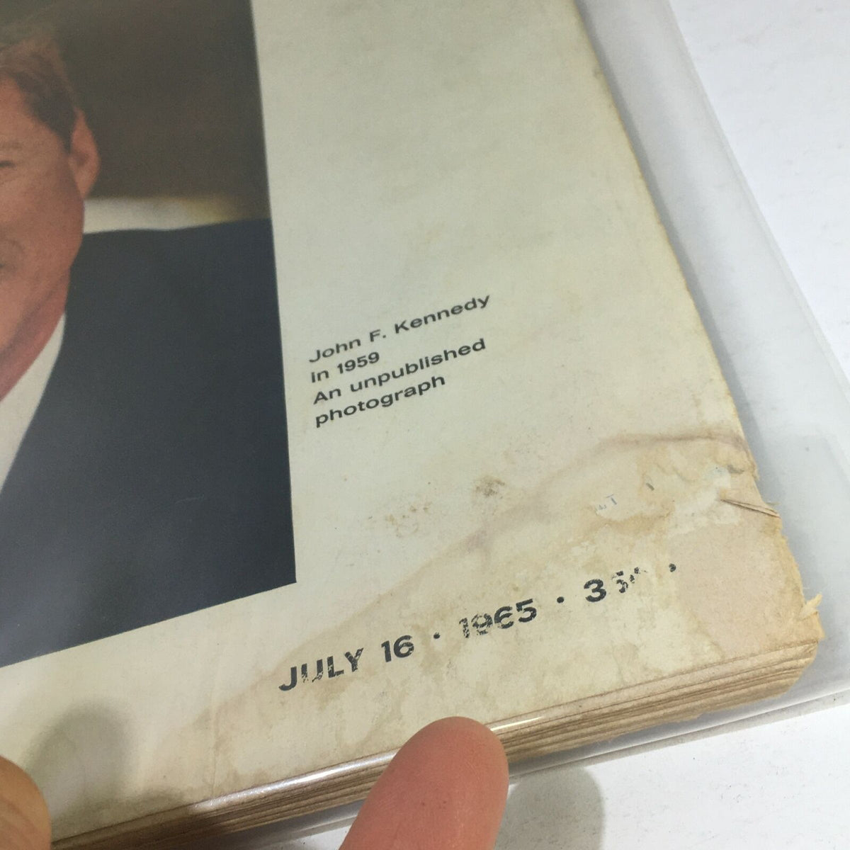 Close-up view of the date on the VTG Life Magazine - July 16 1965, highlighting July 16, 1965, and John F. Kennedy's photograph from 1959.