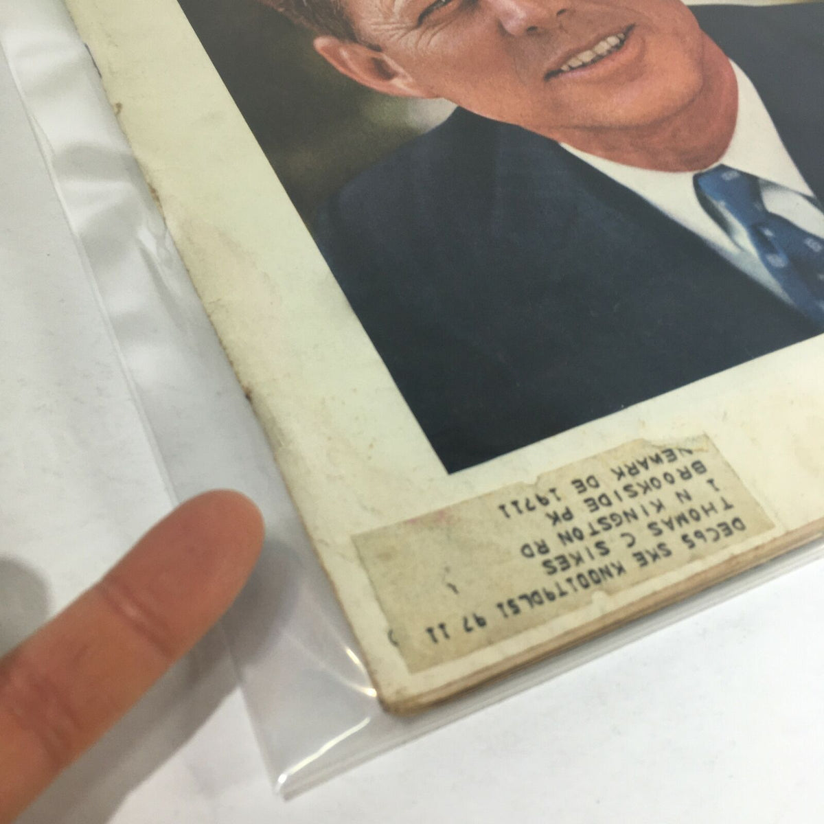 Detail of the back cover corner of the VTG Life Magazine - July 16 1965, showing past owner's information and part of John F. Kennedy's iconic photograph.