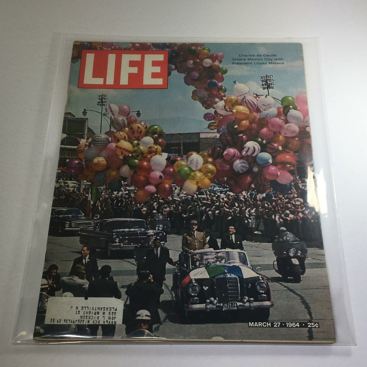 VTG Life Magazine Cover from March 27, 1964, featuring Charles de Gaulle entering Mexico City with President Lopez Mateos amidst a festive atmosphere of balloons and a parade.
