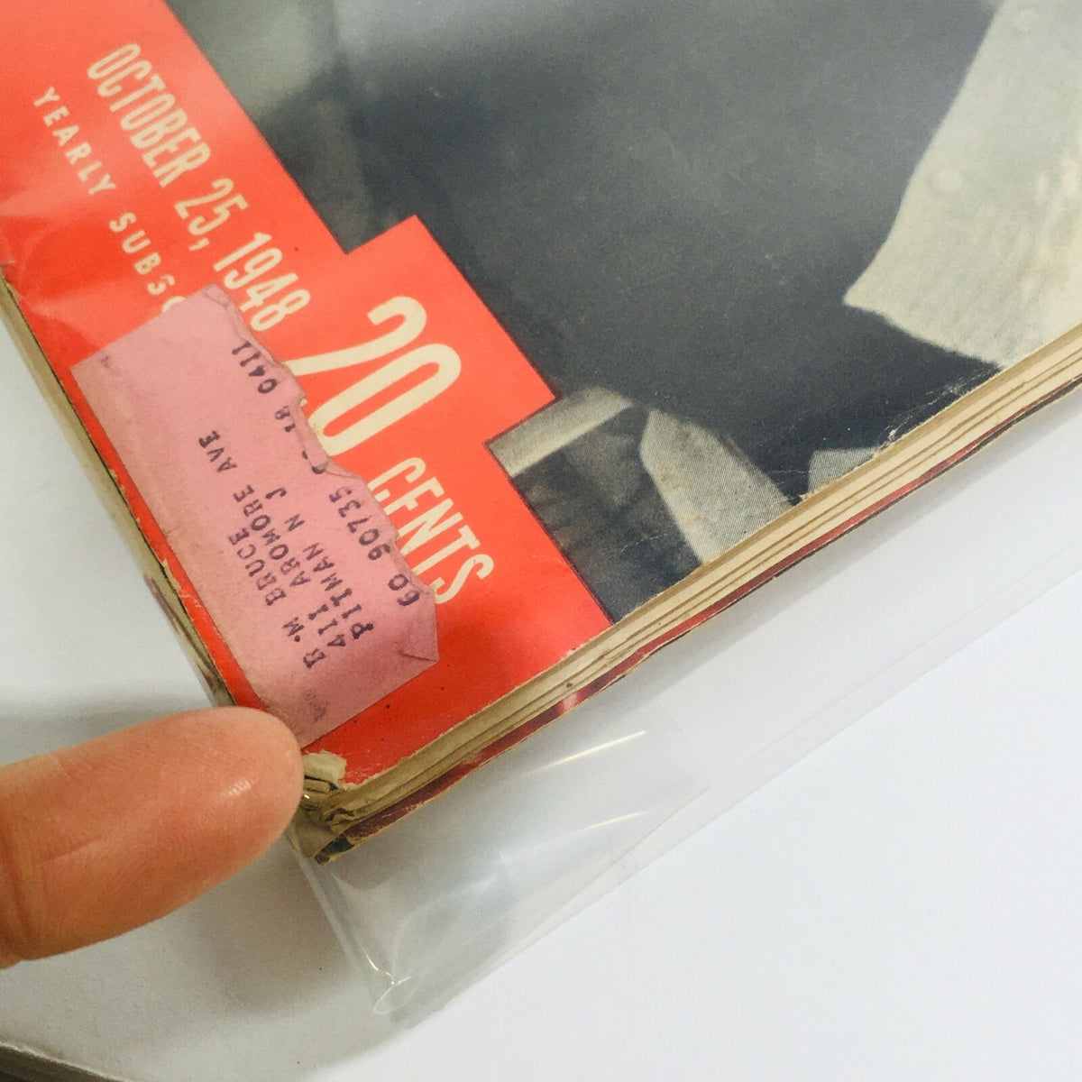 Detailed view of the corner of the VTG Life Magazine: Oct 25 1948, showcasing a vintage address label and the publication date on the cover.