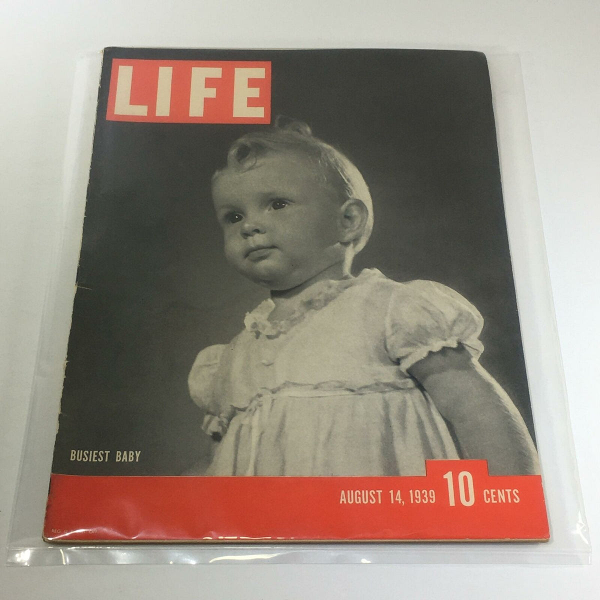 Vintage Life Magazine cover from August 14, 1939, featuring the title 'Busiest Baby', showcasing a black and white image of an adorable baby, a prominent piece of historical memorabilia.