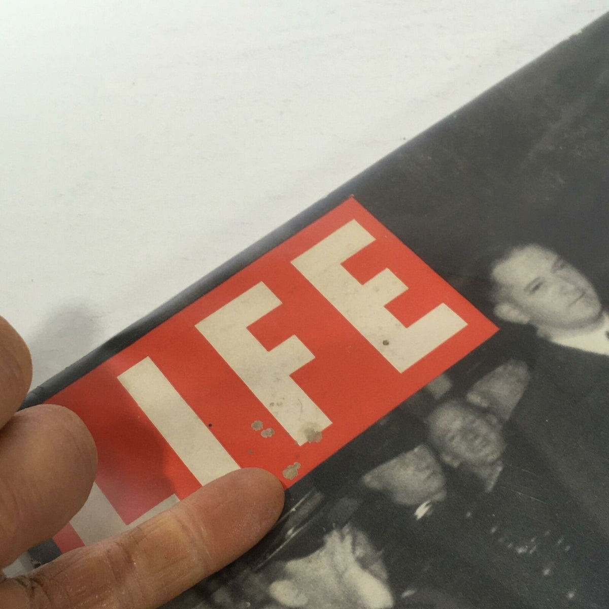 Close-up of the Vintage Life Magazine Cover with visible signs of age and wear, including small marks on the title area.