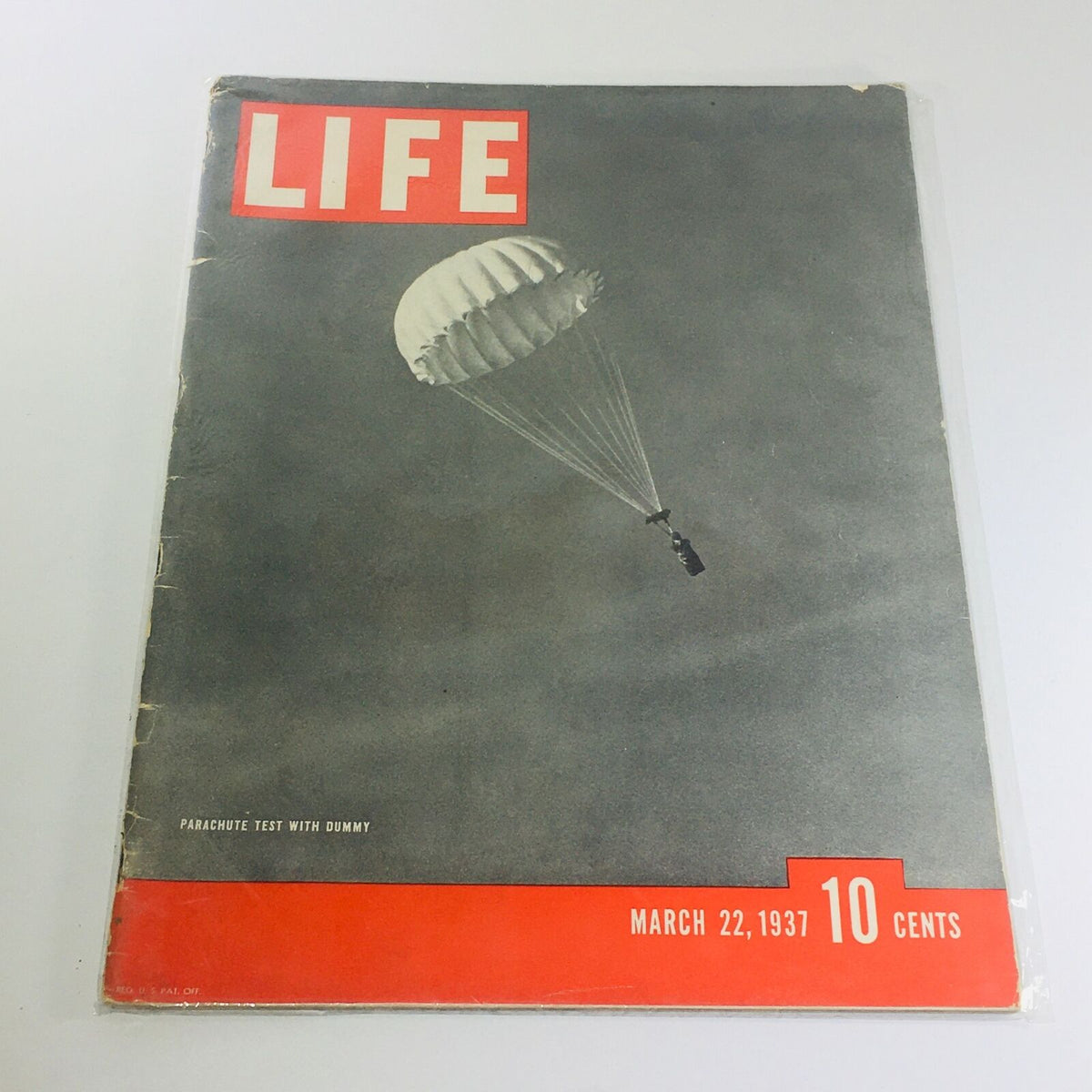 Vintage Life Magazine Cover from March 22, 1937 featuring a parachute test with a dummy, showcasing a significant moment in aviation history.