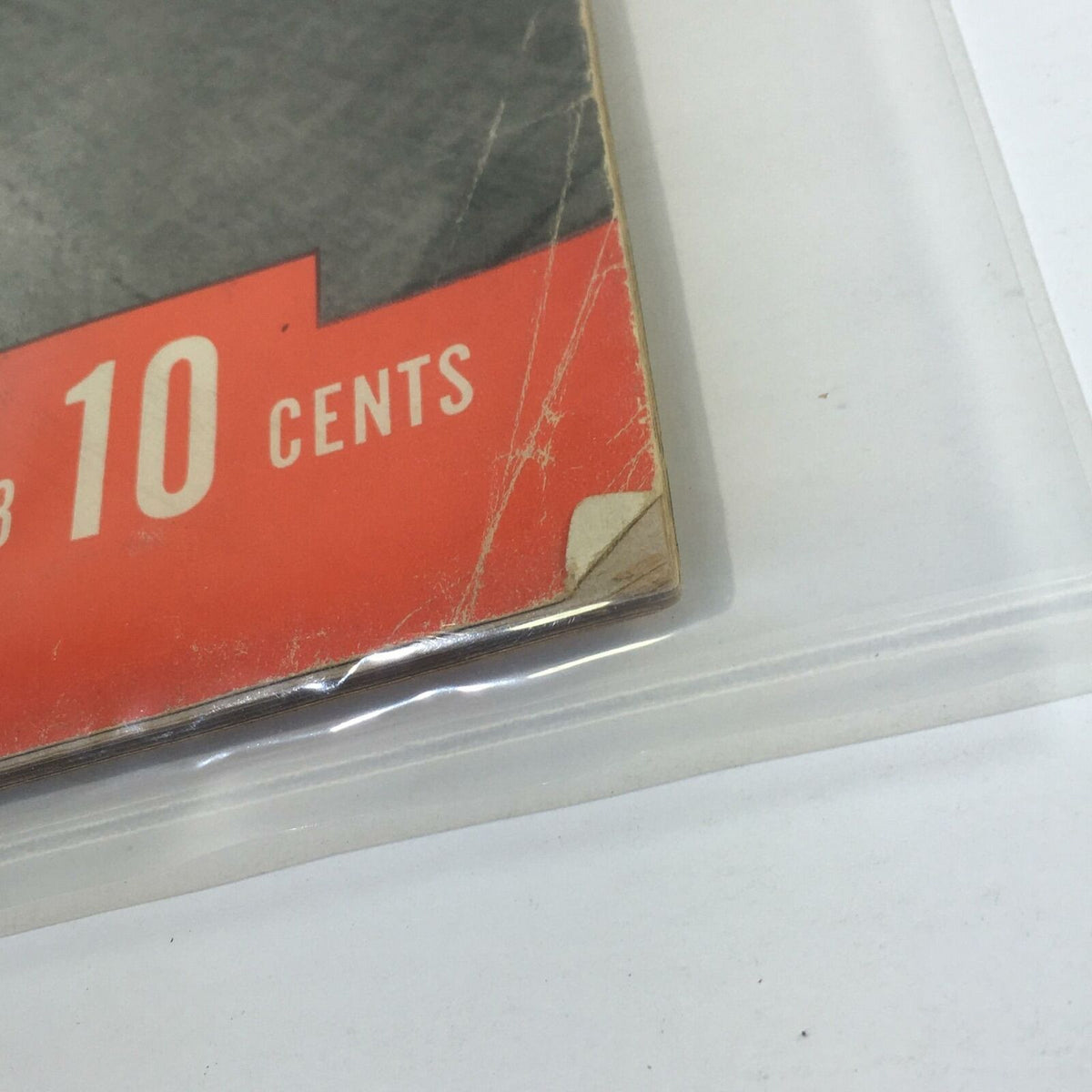 Close-up of the corner of Vintage Life Magazine, November 7, 1938, illustrating wear and tear while highlighting '10 cents' price tag as part of its vintage charm.