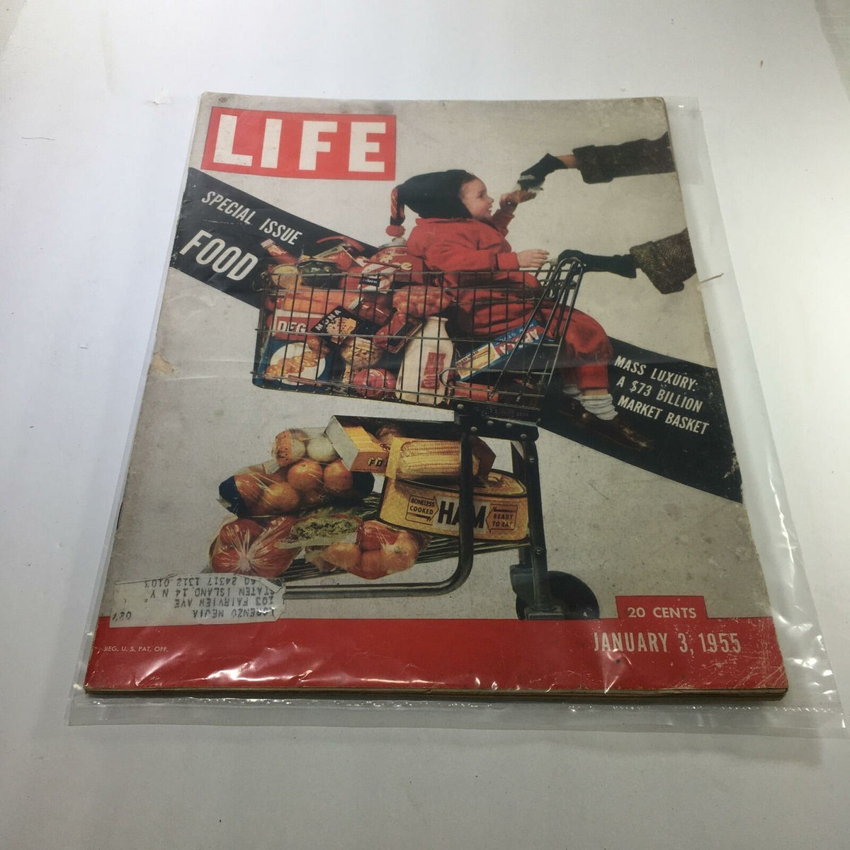 Cover of the VTG Life Magazine: January 3, 1955 Special Issue: Food, featuring a child in a red coat sitting in a shopping cart filled with groceries, showcasing mid-20th century food culture and a nostalgic design.