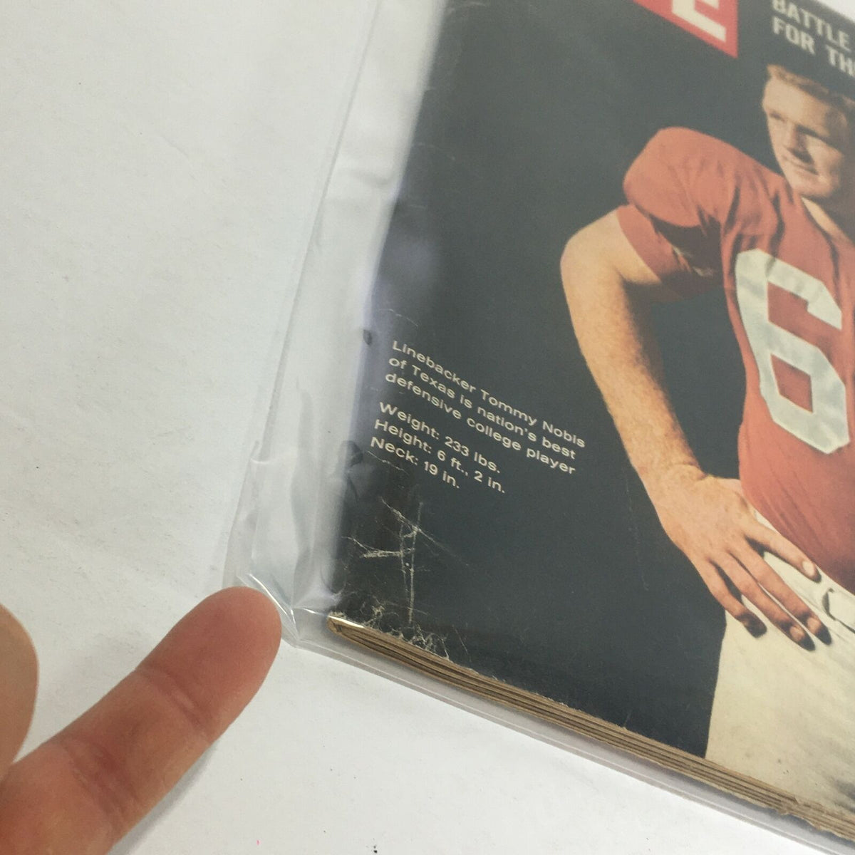 Close-up of the VTG Life Magazine - December 10, 1965 cover featuring linebacker Tommy Nobis, highlighting his statistics as a top college player.