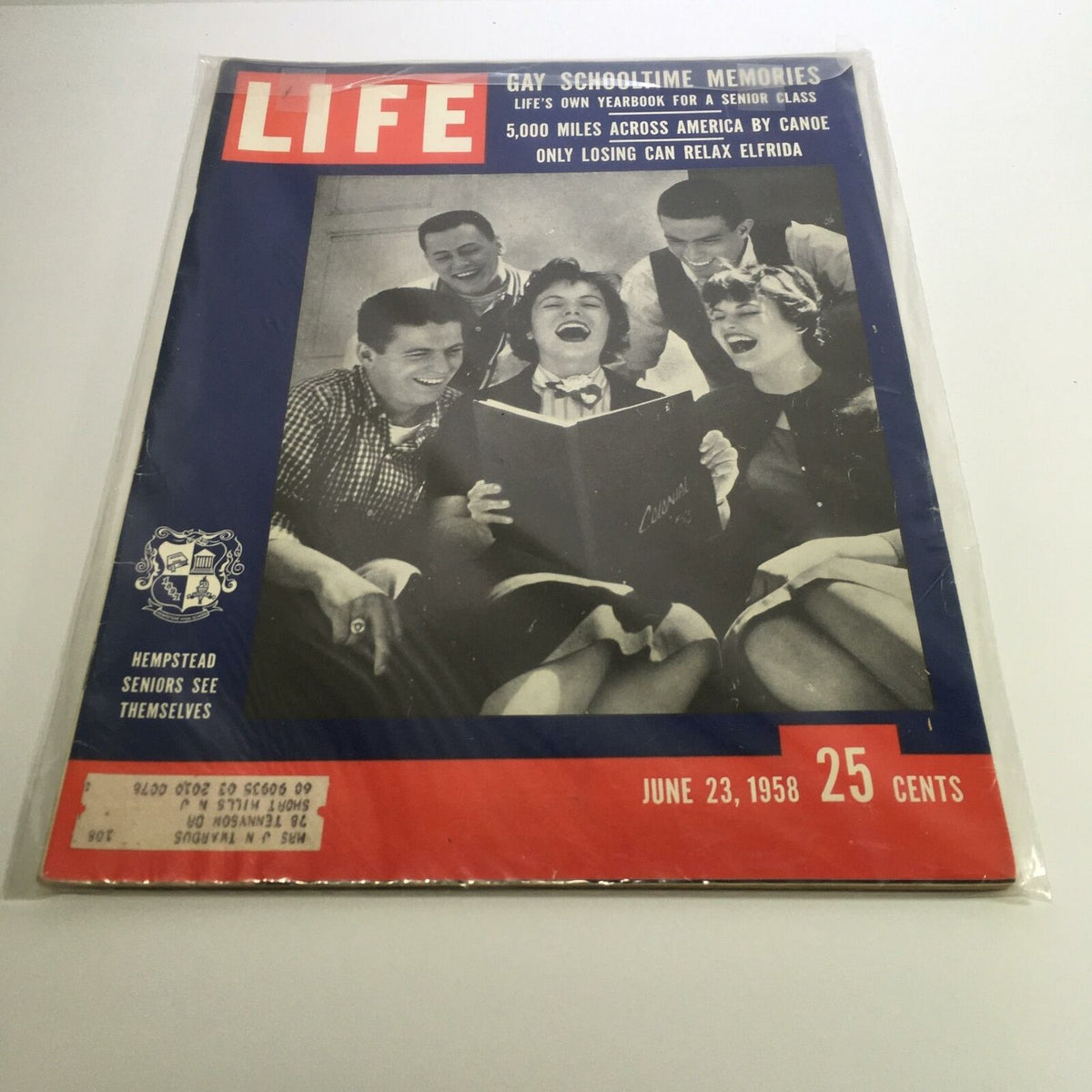 Cover of Life Magazine from June 23, 1958, featuring a joyful group of Hempstead seniors celebrating their graduation. The magazine highlights school memories and includes the phrase 'Hempstead Seniors See Themselves.' A nostalgic collectible representing late 1950s youth culture.