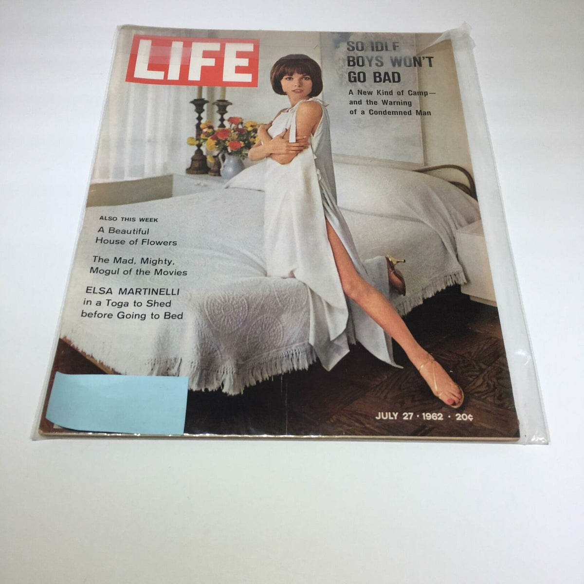 Life Magazine cover from July 27, 1962 featuring Elsa Martinelli in a toga before going to bed. The magazine highlights the glamour of the early 1960s and includes articles on cultural reflections of that era.