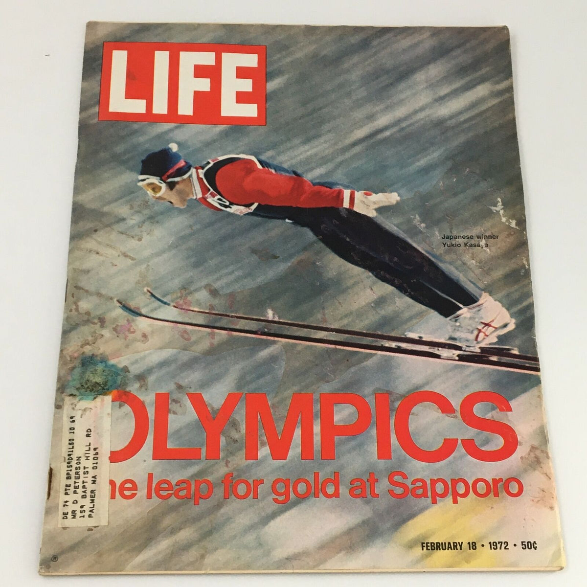 Cover of VTG Life Magazine February 18 1972 featuring Japanese Olympic Athlete Yukio Kasaya, showcasing the title 'OLYMPICS: The leap for gold at Sapporo' with visually striking art and wear indicative of its vintage status.